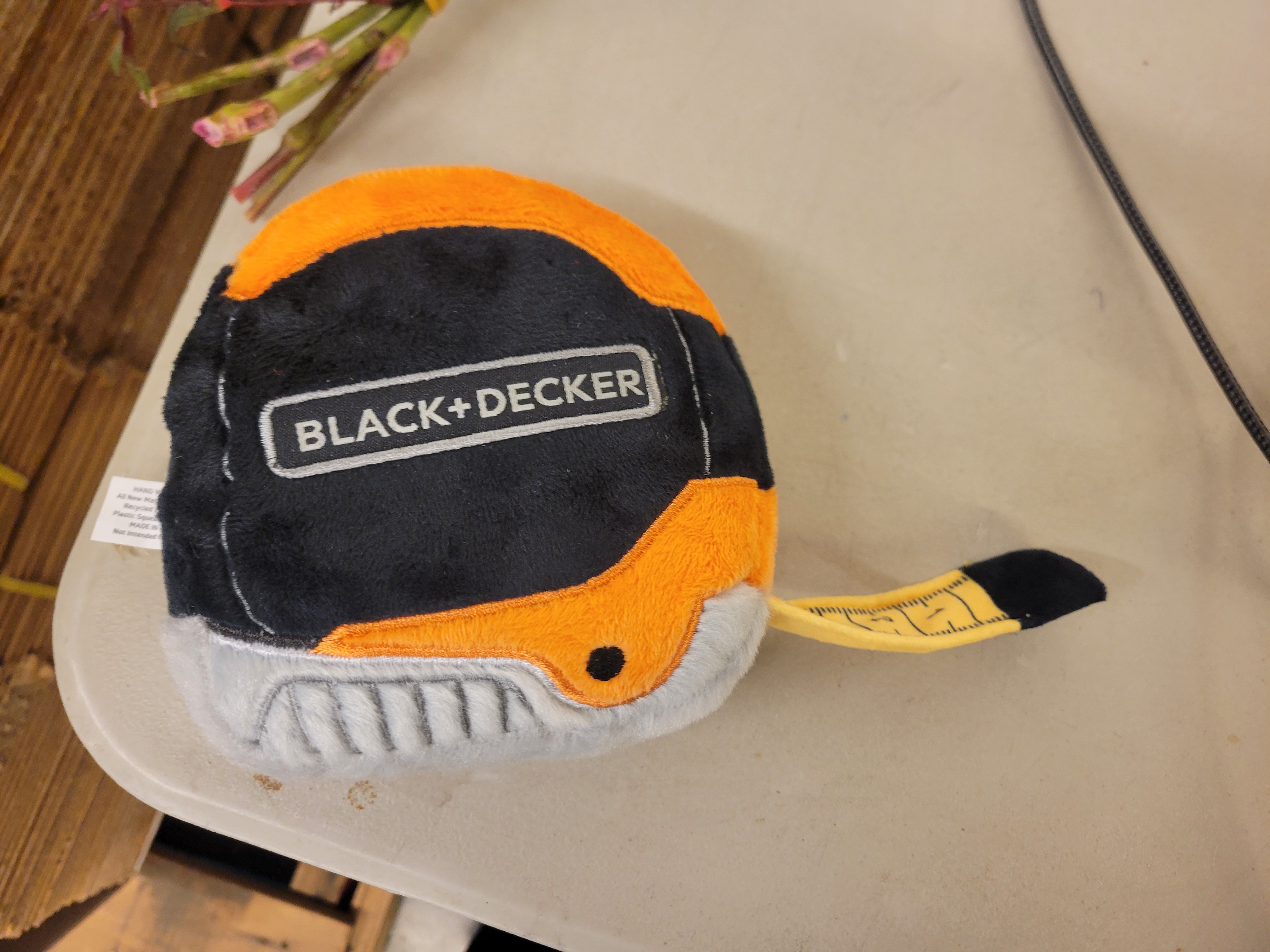 Tape measurer squeaker dog toy.